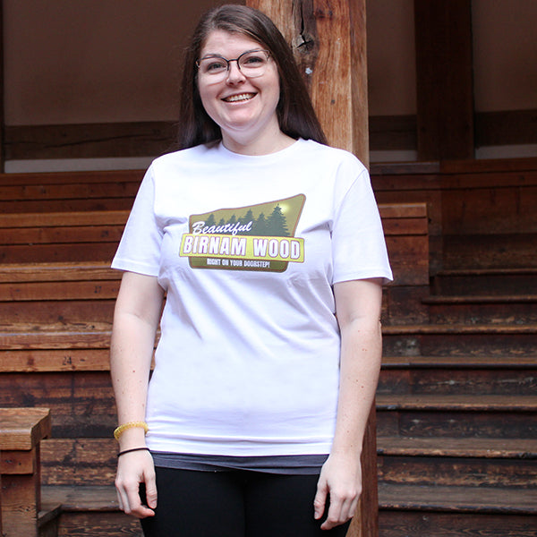 
                      
                        White t-shirt with yellow, green and white graphic image in centre
                      
                    