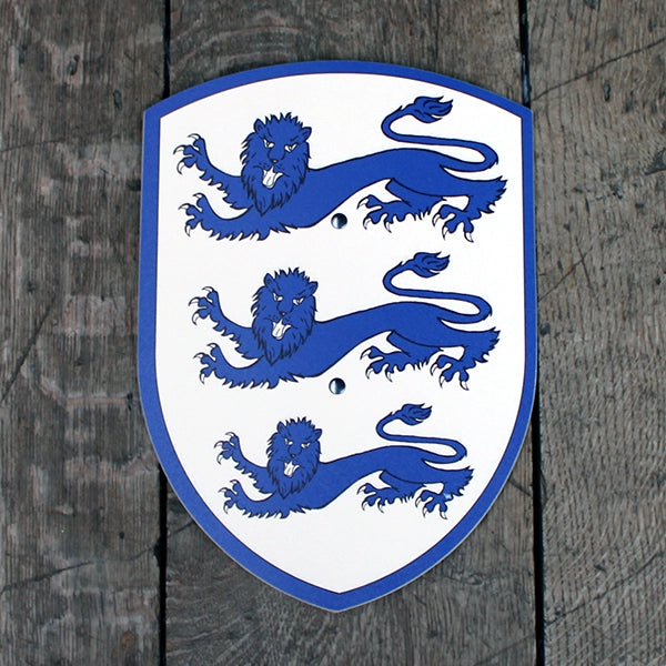 Wooden toy shield, painted white with royal blue edging and three blue lines one atop the other