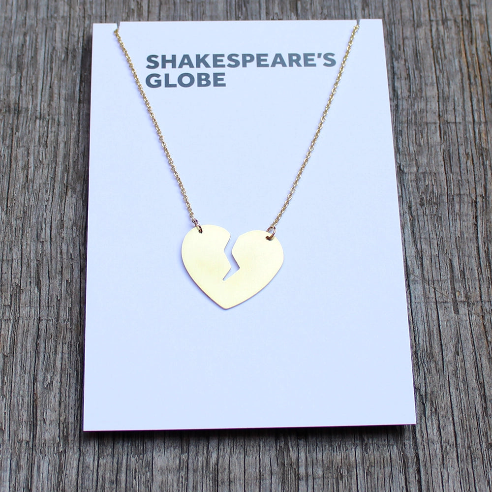 Brass split heart on brass chain, sitting on white backing card