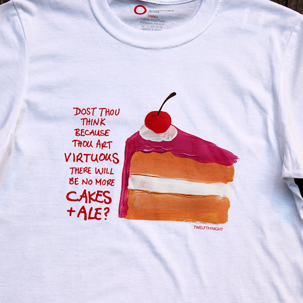 
                  
                    White cotton standard fit t-shirt with centre front graphic of a slice of vanilla cake with hot pink frosting and a cherry on top, with scratchy red writing down the left side
                  
                