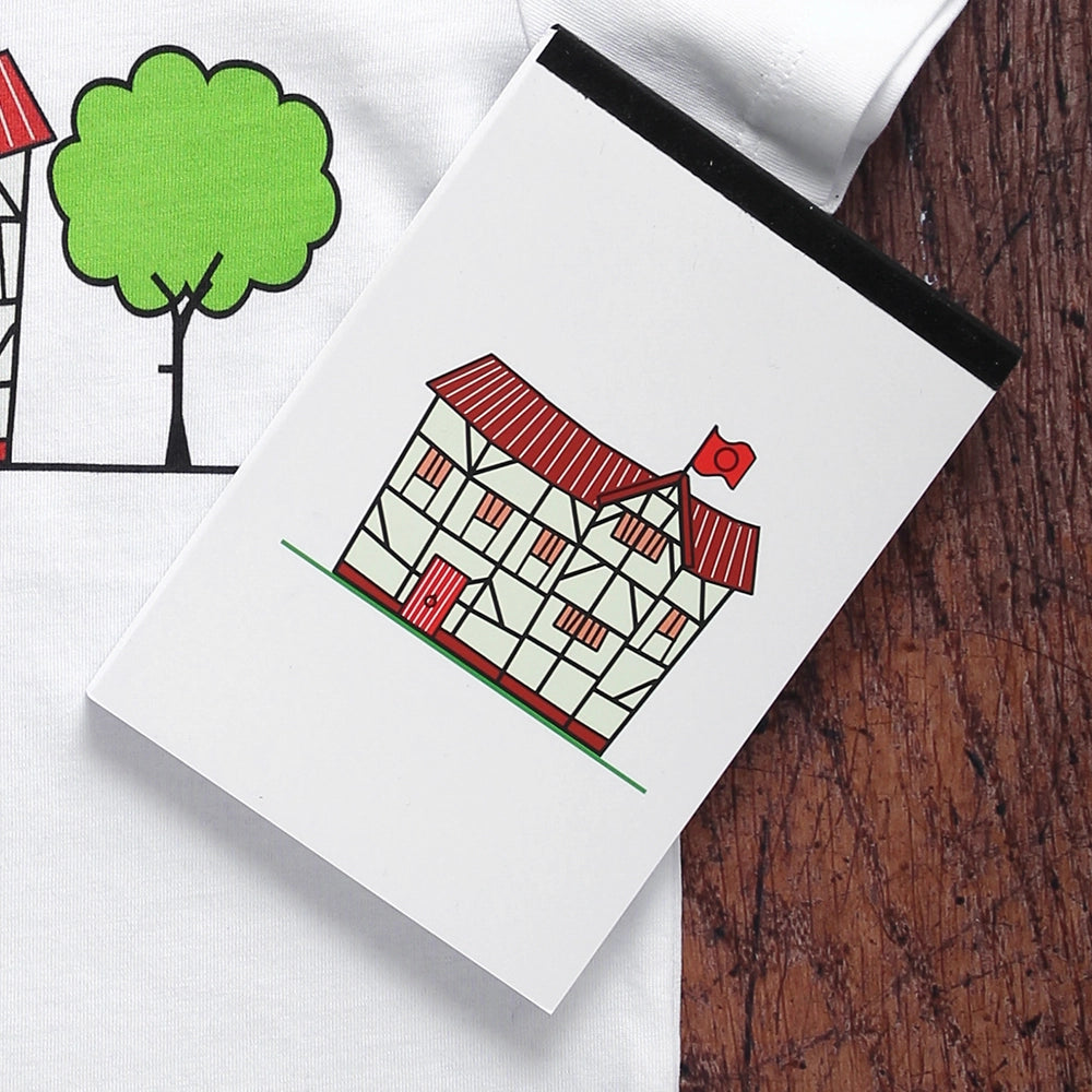 White pocket sized notepad with a print of a cartoon version of Shakespeare's Globe Theatre on the cover. The little Globe Theatre has a dark red roof and a red flag and door.