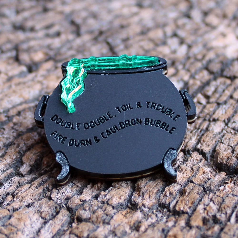 
                      
                        black acrylic cauldron pin with green mirrored acrylic bubbles
                      
                    