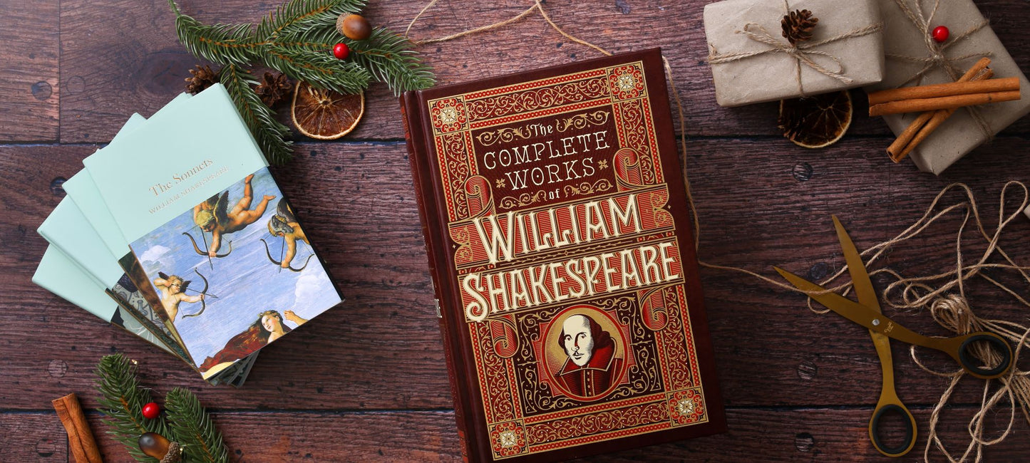 Hardback Shakespeare play texts lying on wood plank floor, with scissors, string, and wrapped brown packages