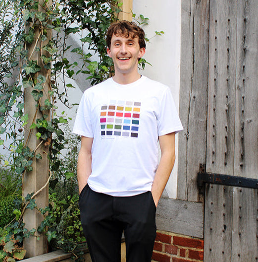 
                  
                    White cotton t-shirt with a colour block design on the chest
                  
                