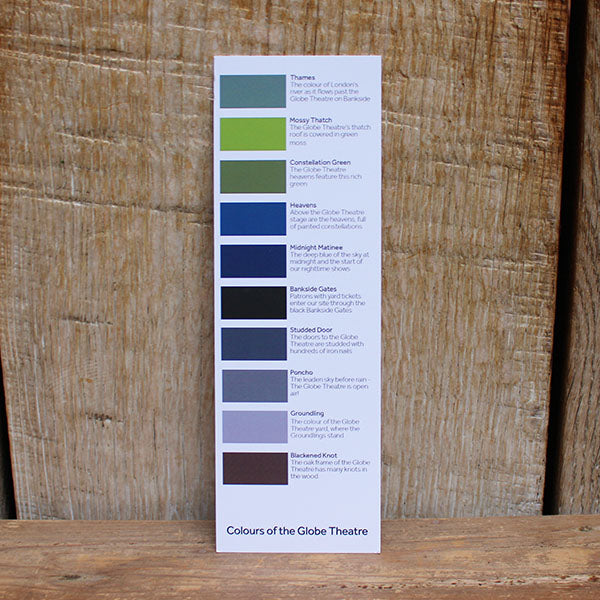 white card bookmark with blocks of colour on a wooden background