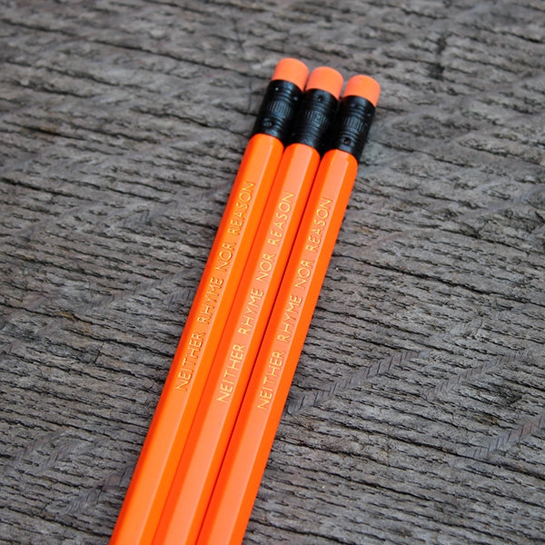 Neon orange pencil with matching eraser and gold etched text