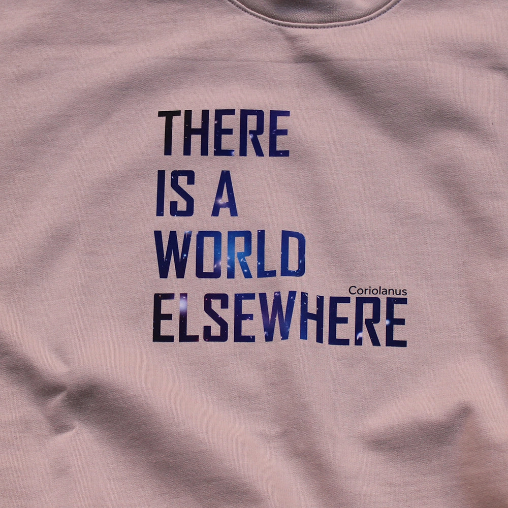 Sand coloured sweatshirt with graphic text featuring blue image of the cosmos in the lettering