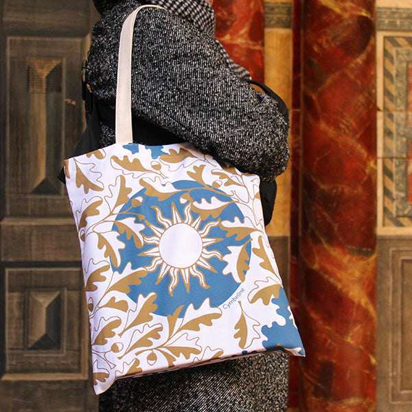 All over print tote bag with blue background and white and gold-look leaf motif