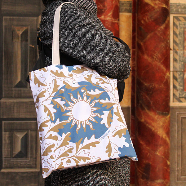 All over print tote bag with blue background and white and golf leaf motif