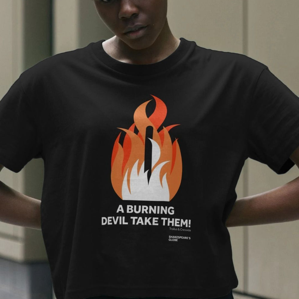 Black cotton boxy style t-shirt with centre front graphic of shades of orange fire burning around a wooden stake, with white block text below