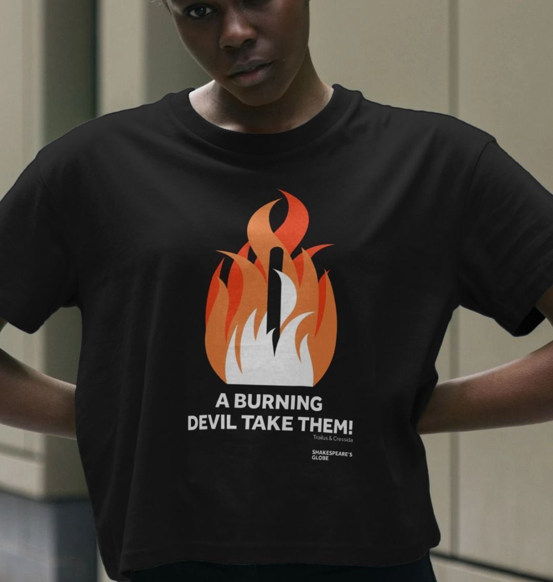 Black cotton boxy style t-shirt with centre front graphic of shades of orange fire burning around a wooden stake, with white block text below