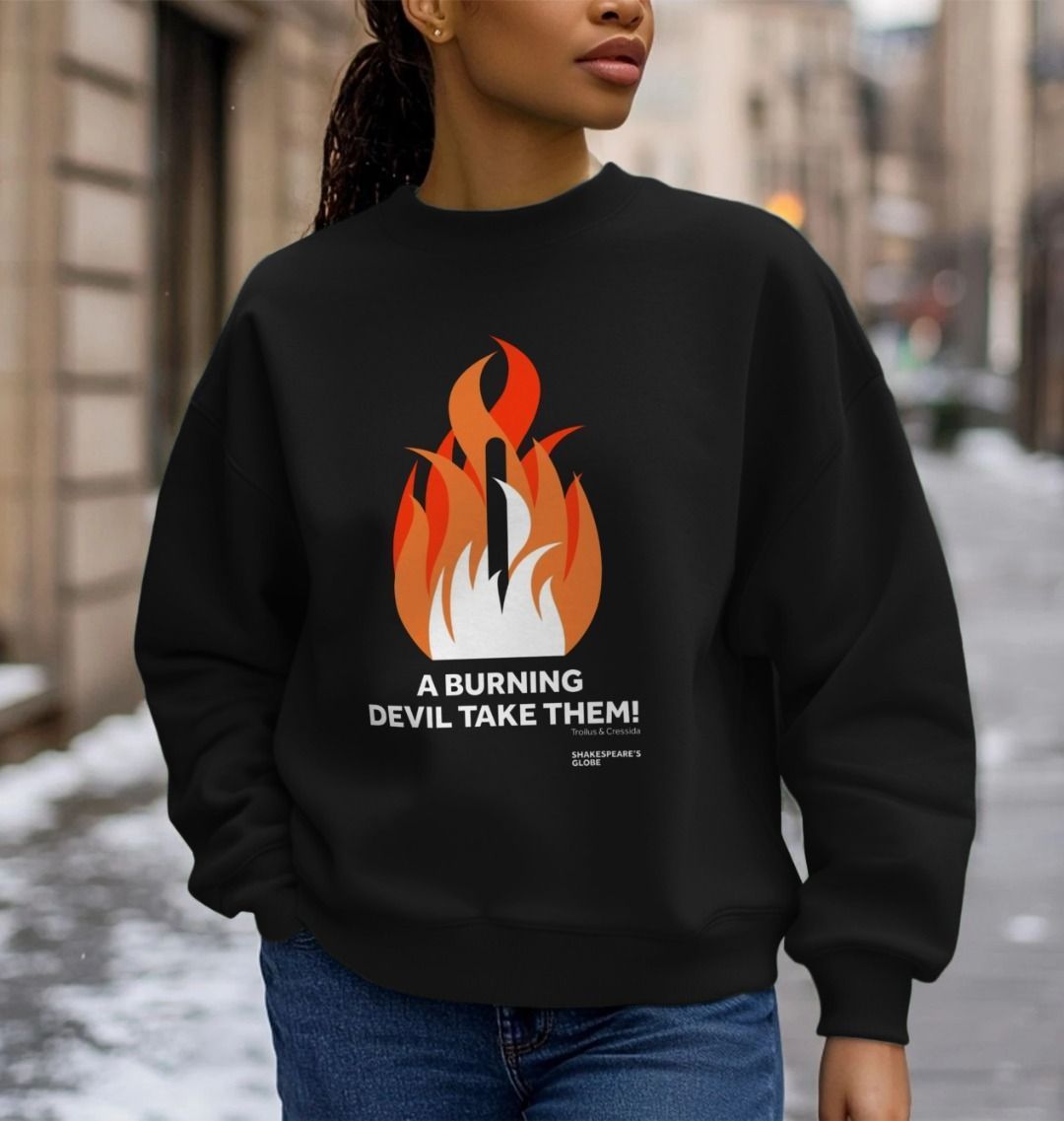 Black cotton oversized ladies sweatshirt with centre front graphic of shades of orange fire burning around a wooden stake, with white block text below