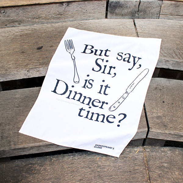 white tea towel with black text and an illustration of a knife and fork print