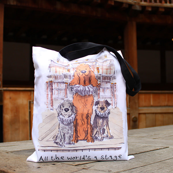 
                      
                        White cotton tote bag with black straps and graphic of 3 dogs in ruffs on Globe stage
                      
                    