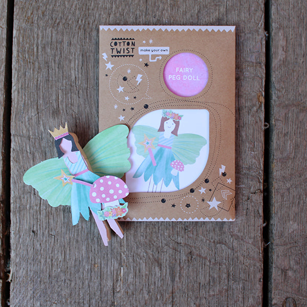 Paper peg fairy with short black hair, gold crown, teal wings and dress, pink and gold wand, and mushroom