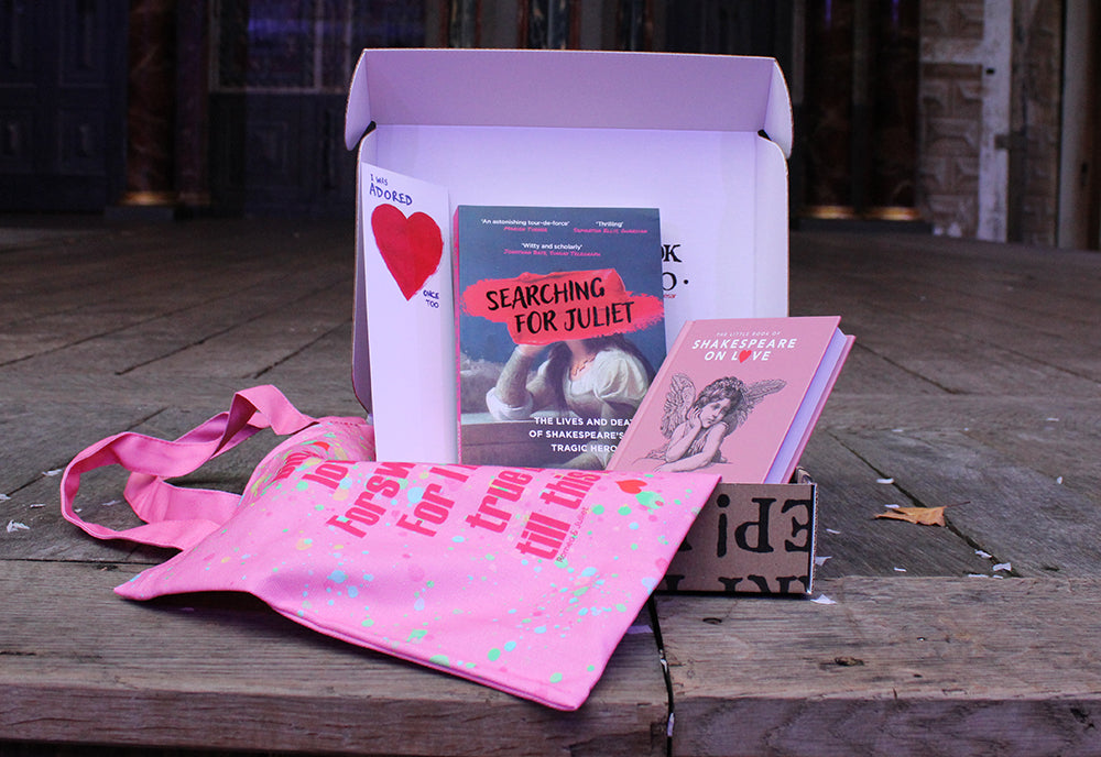 
                  
                    Card book box, open, with pink cotton printed bag spilling out, paperback and hardback love themed books, and white card bookmark with red heart and blue writing
                  
                