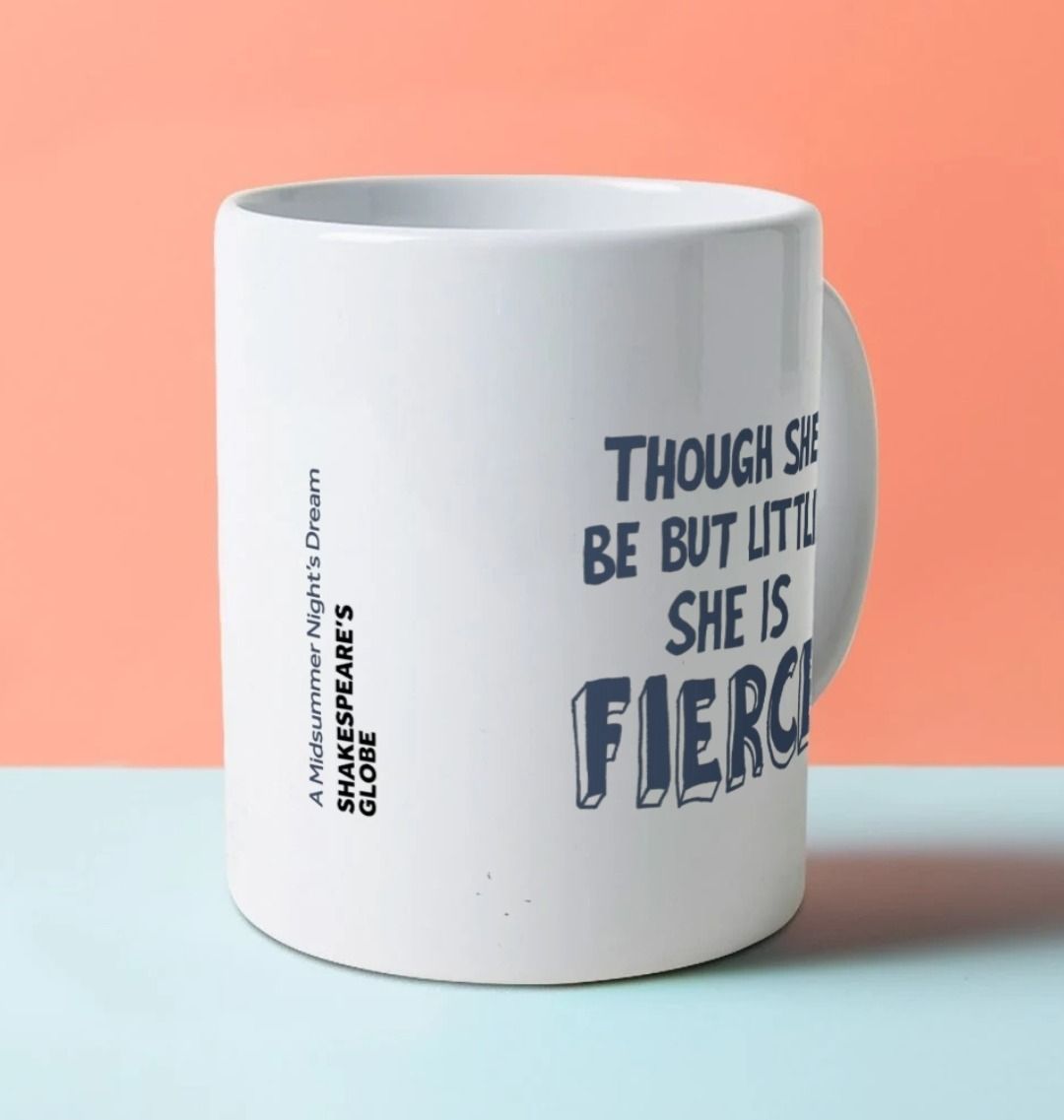 White mug with dark blue stylised 'fierce' quote graphics on either side