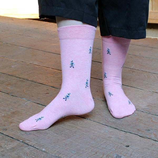 Pale pink cotton blend socks with fool character repeat pattern approximately 1 inch between each character