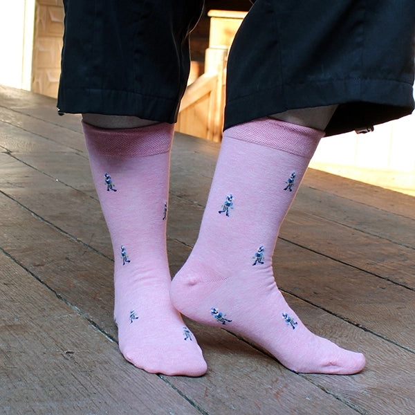 Pale pink cotton blend socks with fool character repeat pattern approximately 1 inch between each character