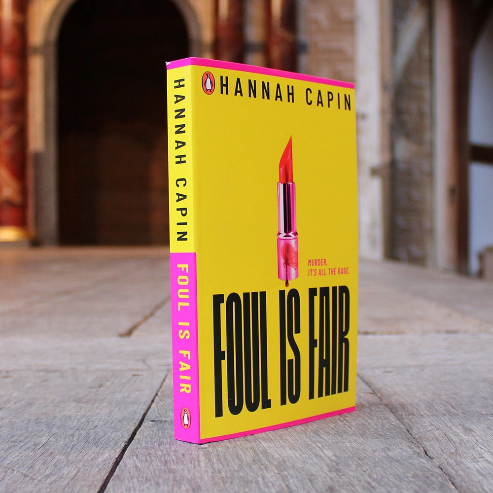 Canary yellow paperback book with bold black text and hot pink lipstick on the centre front with blood dripping on it