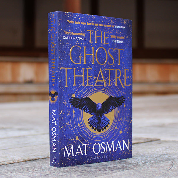 Royal blue paperback book with gold text and detailing, featuring blue falcon graphic on centre front, angled to the right