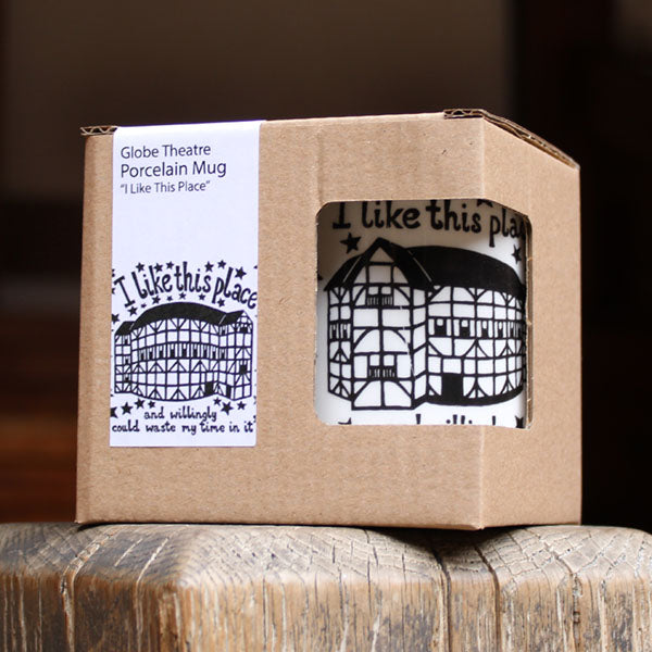 Cardboard box packaging for a porcelain mug with 'Globe Theatre' design, featuring text and architectural illustration.