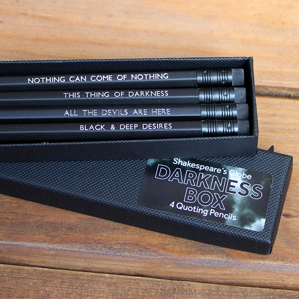 Black kraft box with 4 black pencils with black erasers, printed with silver block capital Shakespeare quotes relating to Halloween