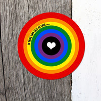 A circular rainbow target sticker with a white heart in the centre and the text 'TO THINE OWN SELF BE TRUE ' on a split wood and white background.
