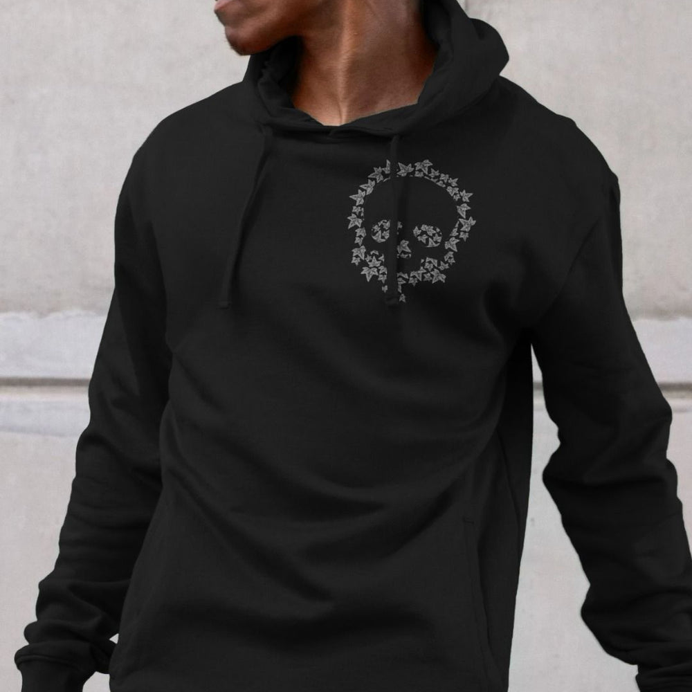 Black cotton sweatshirt graphic with leaf skull motif in pale grey colour on upper left chest 