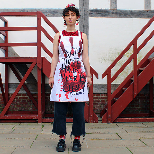 White apron with a bloody handprint design