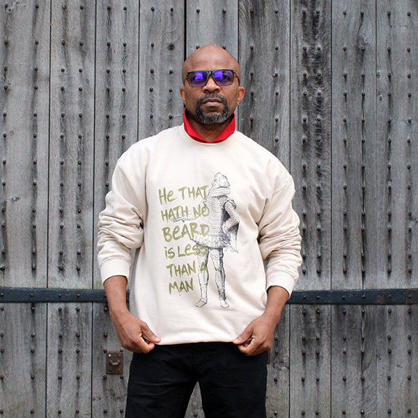 
                  
                    Sand coloured cotton sweatshirt with black line drawing of man in a ruff with a beard and gold text
                  
                