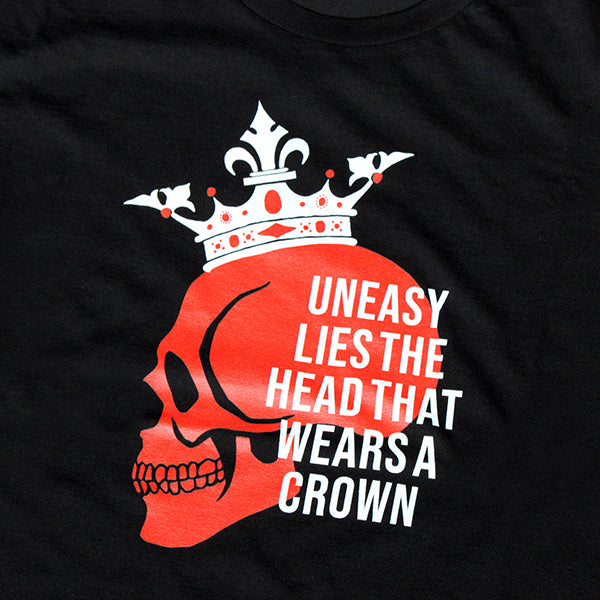 
                  
                    Black cotton t-shirt with red skull graphic with white crown
                  
                