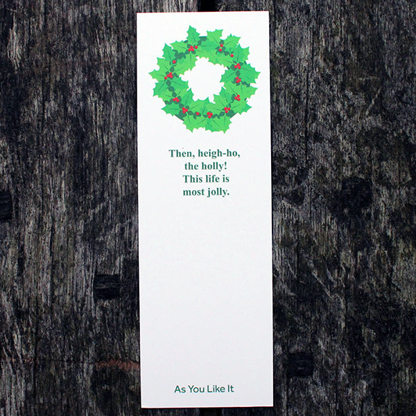 White rectangular bookmark with green leaf graphic at the top and forest green text below