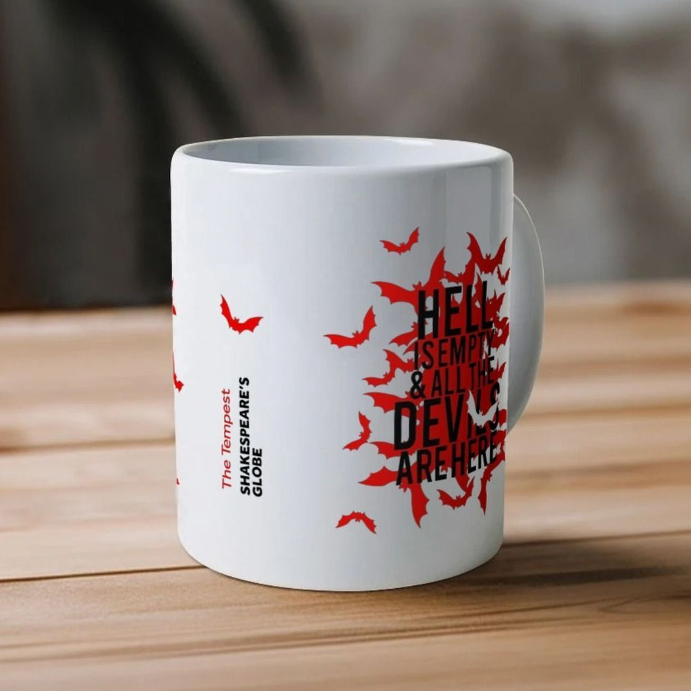 White mug with red bats graphic on either side, with black text overtop