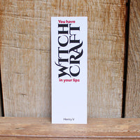 white card bookmark with black text on a wooden background