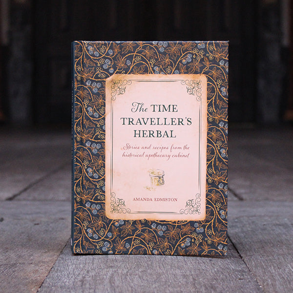
                  
                    Blue and green and beige hardback book with green script text
                  
                