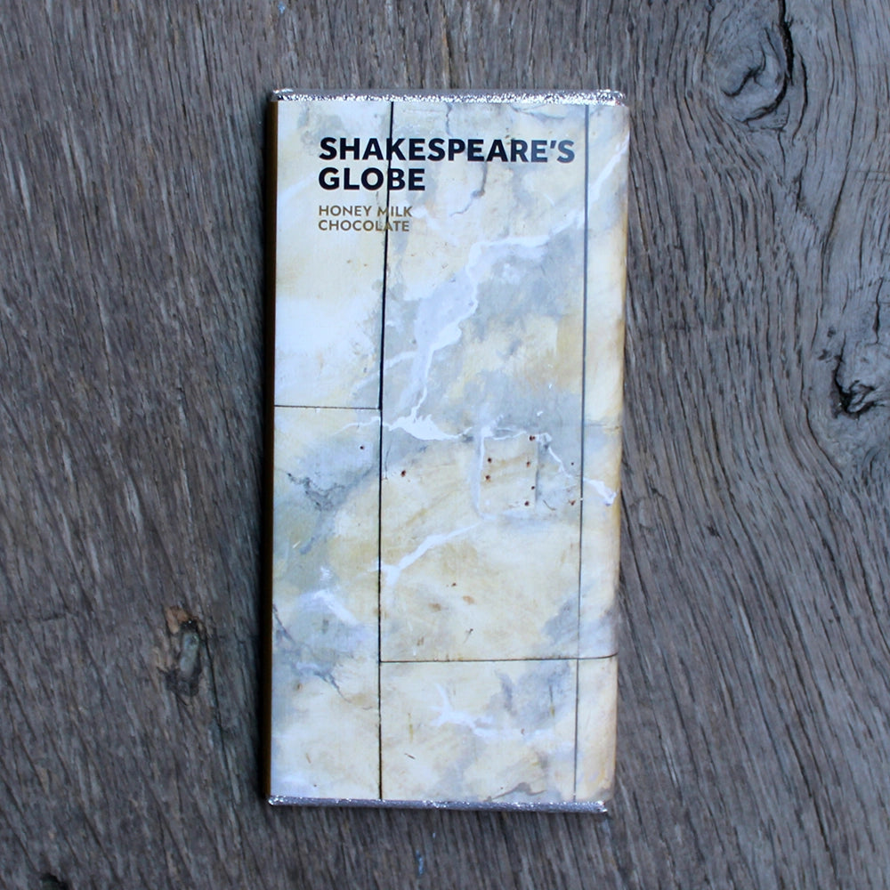 Foil wrapped chocolate bar with printed paper wrap indicating Shakespeare's Globe