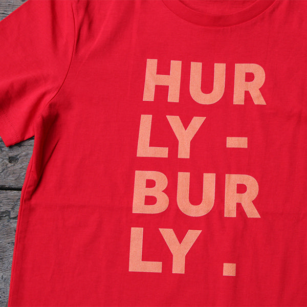 
                      
                        Red graphic t-shirt with orange text aligned to the left
                      
                    