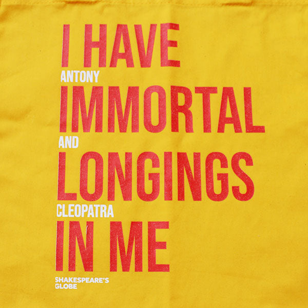yellow bag with an orange and white text print
