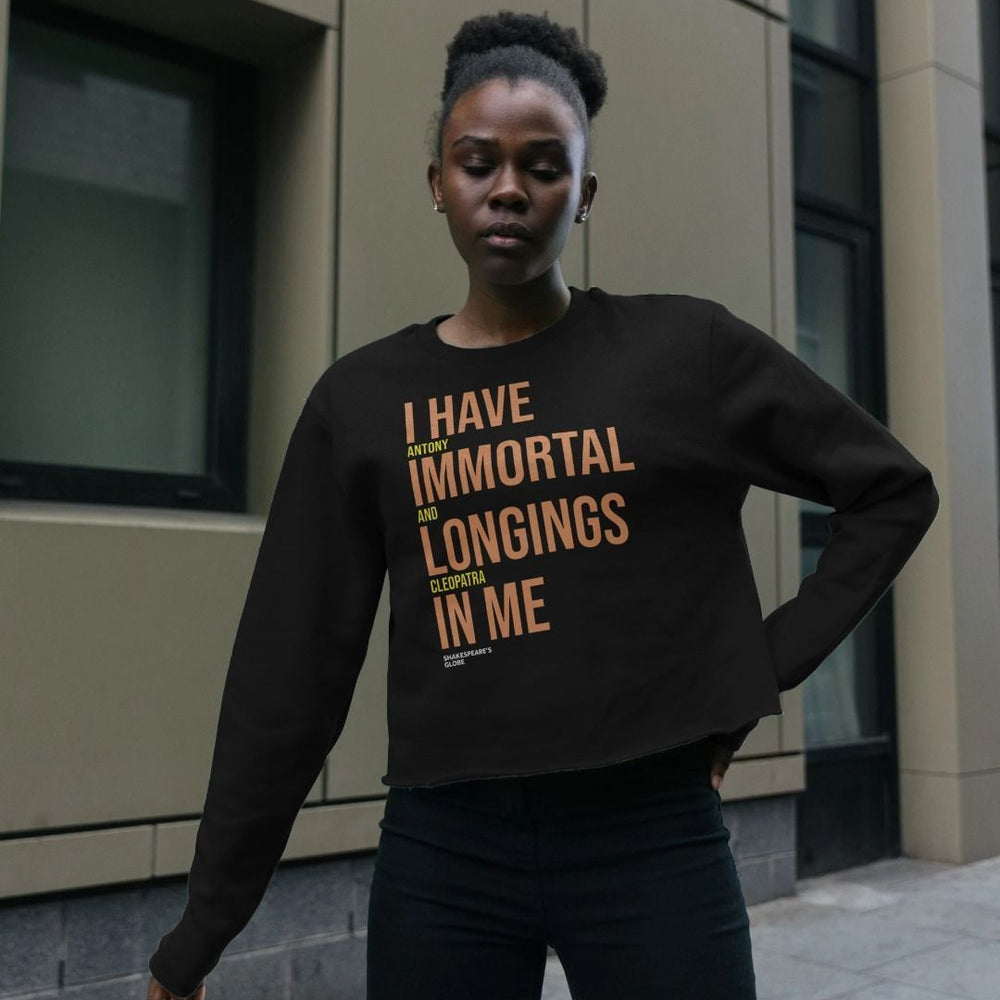 Black boxy sweatshirt with orange and yellow graphic text print on the centre front