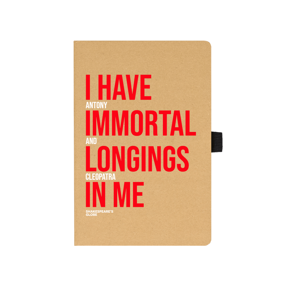 Kraft notebook with red and white graphic text on the front, with black elastic closure