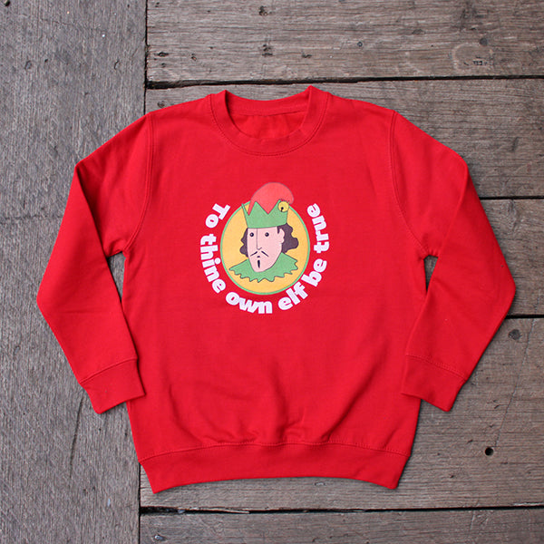 
                      
                        Cherry red kids sweatshirt with cartoon William Shakespeare in elf hat with white text surround
                      
                    
