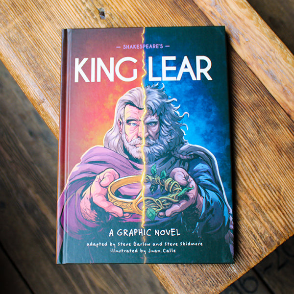 Book titled 'King Lear' by Shakespeare on a wooden surface