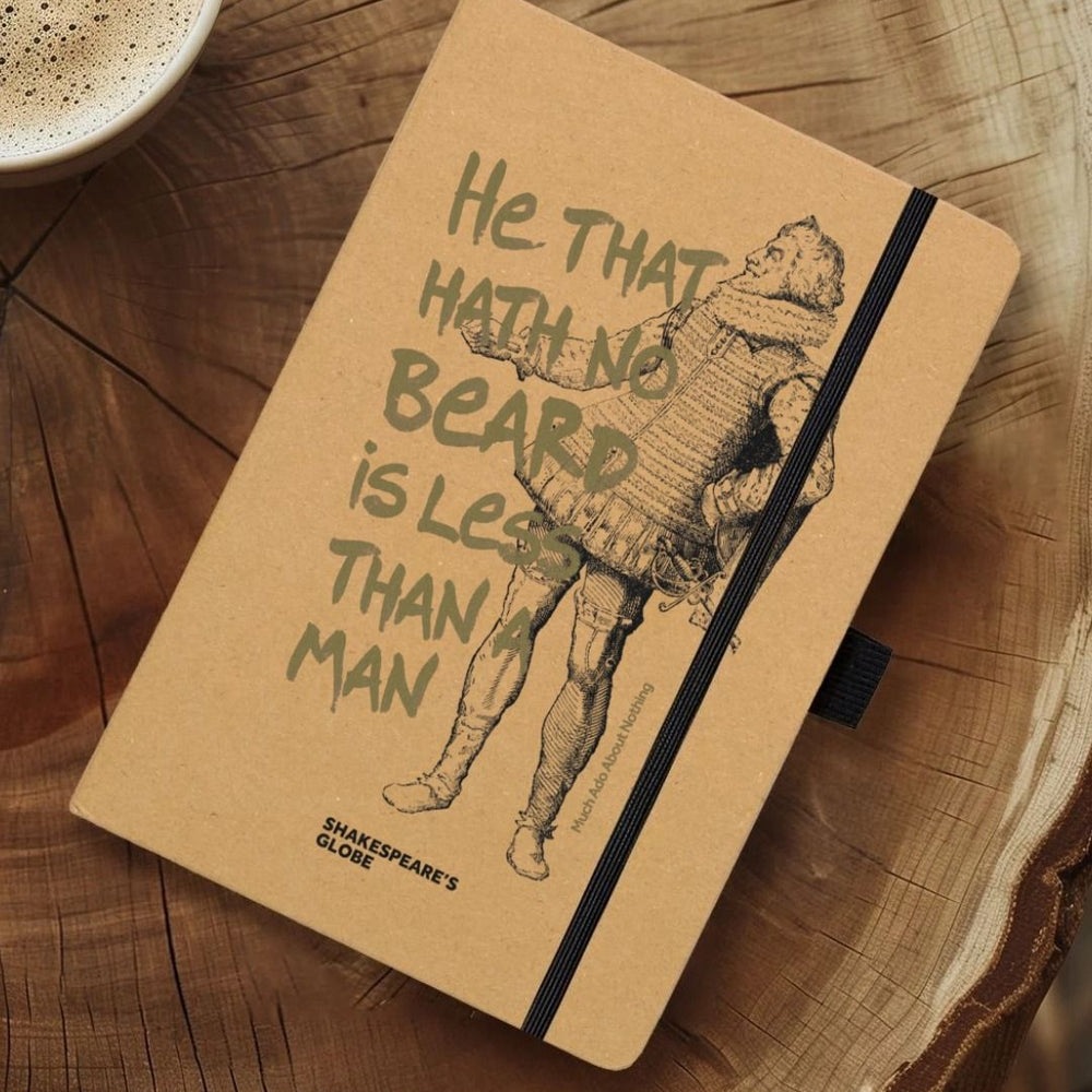 Natural kraft notebook with graphic of Shakespearean man with gold graphic text over top