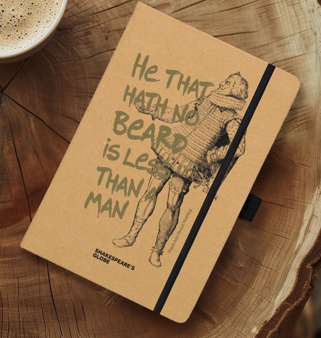 Natural kraft notebook with graphic of Shakespearean man with gold graphic text over top