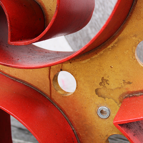 Close-up of a red and yellow wooden letter