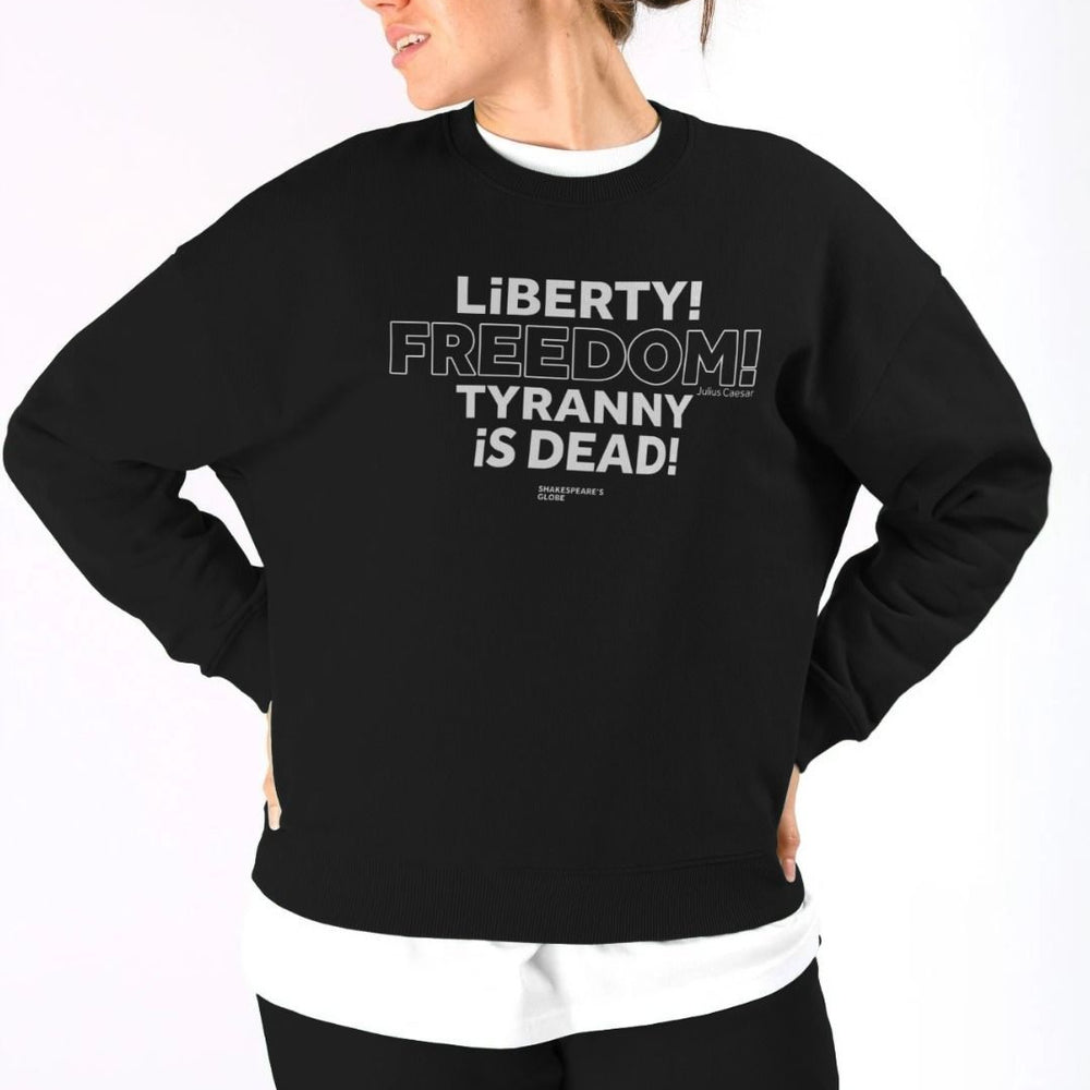 Black oversized fit women's sweatshirt with centre front graphic text in white colour, all letters filled in except for the word Freedom which is outlined in white only