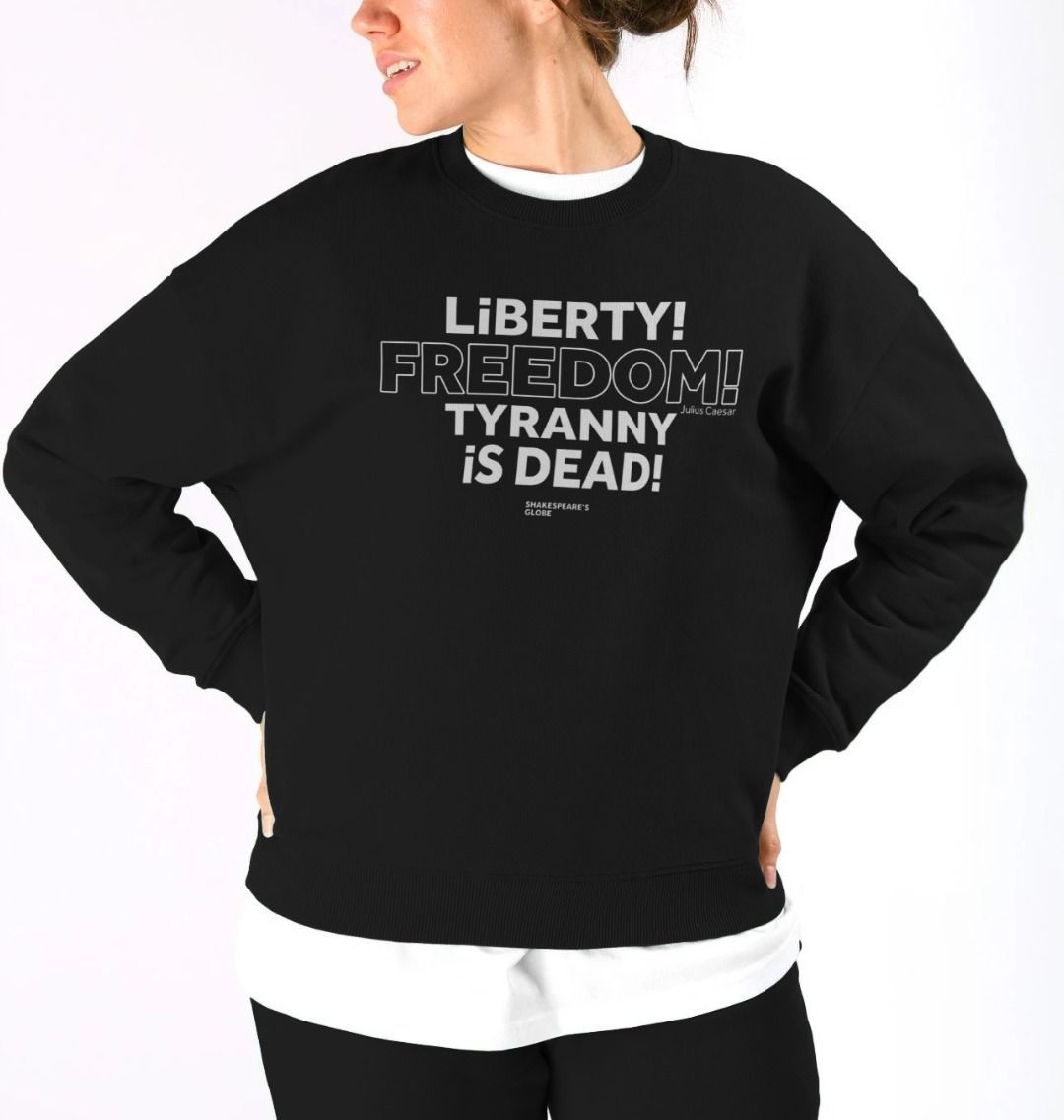 Black oversized fit women's sweatshirt with centre front graphic text in white colour, all letters filled in except for the word Freedom which is outlined in white only