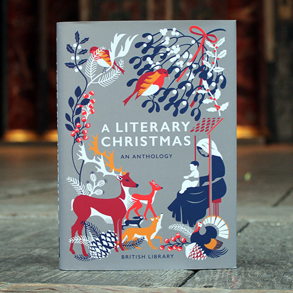 Book titled 'A Literary Christmas' with festive illustrations on a wooden surface.