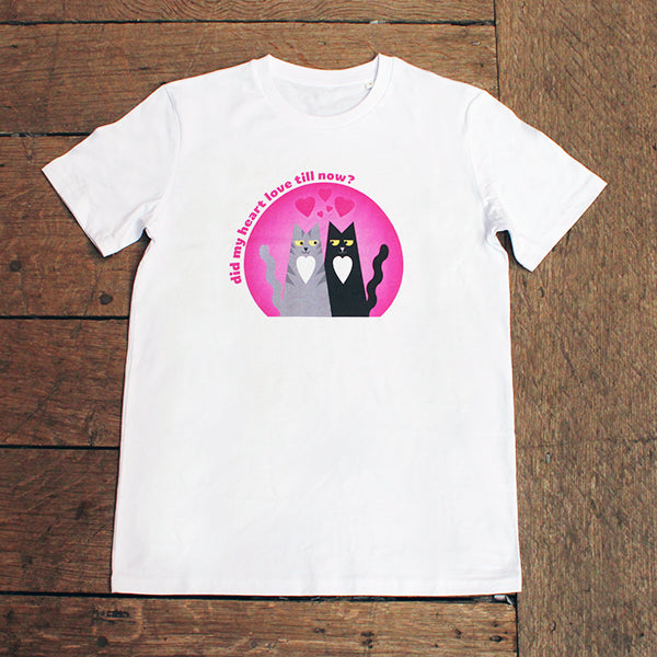 White cotton t-shirt with a pink graphic on the chest with a grey and a black cat 